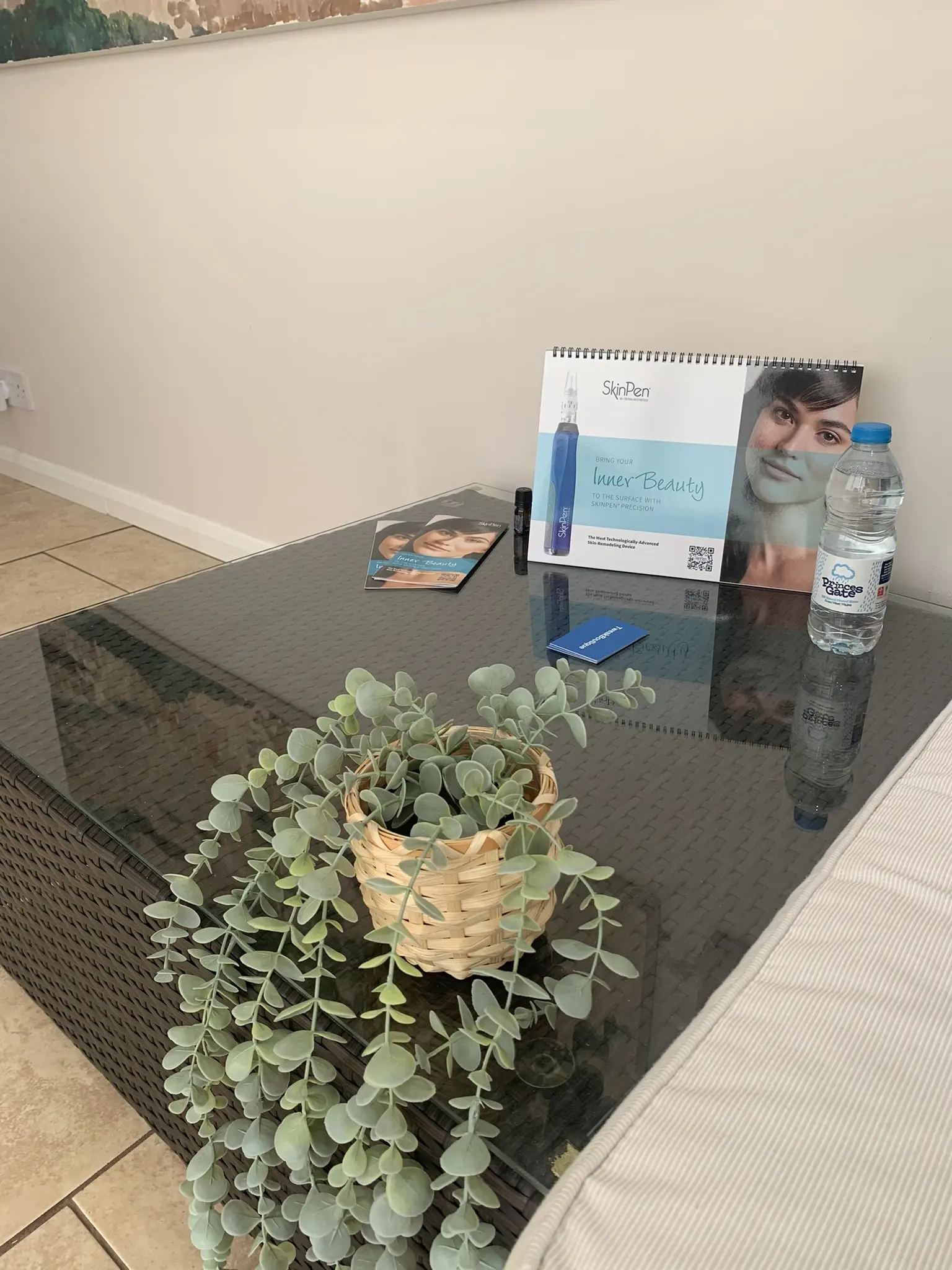 The consultation table in the TweakBoutique clinic, with treatment leaflets and a SkinPen brochure